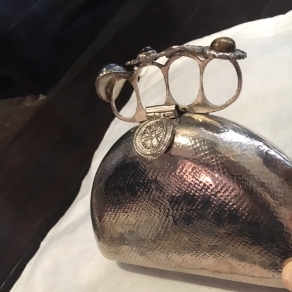 From St Xavier Silver Brass Clutch